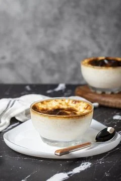 Rice pudding on a dark background. Rice pudding dessert made with milk. Turki Stock Photos
