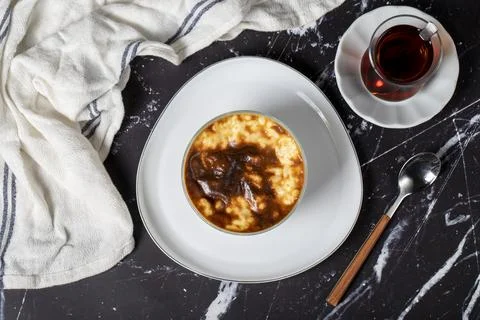 Rice pudding on a dark background. Rice pudding dessert made with milk. Turki Stock Photos