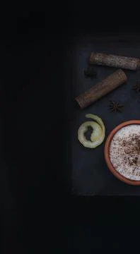 Rice pudding dessert served in an earthenware dish on a slate table accompani Stock Photos