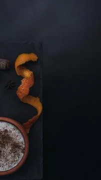 Rice pudding dessert served in an earthenware dish on a slate table accompani Stock Photos