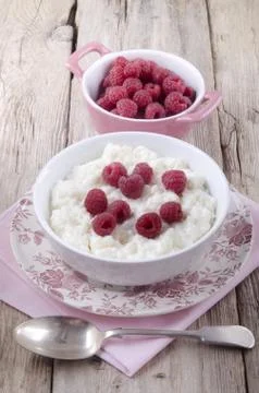 Rice pudding with fresh raspberry Stock Photos