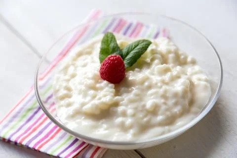 Rice pudding with mint and raspberry 스톡 사진