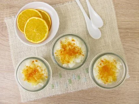 Rice pudding with orange sugar Stock Photos