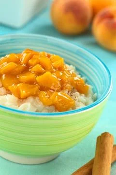 Rice pudding with peach compote Stock Photos