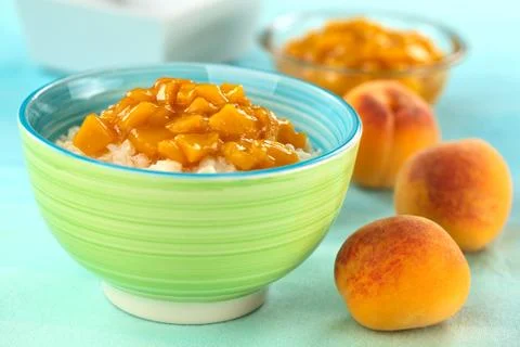 Rice pudding with peach compote Stock Photos