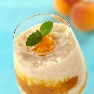 Rice pudding with peach compote Stock Photos