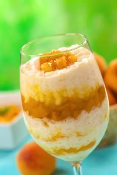 Rice pudding with peach compote Stock Photos
