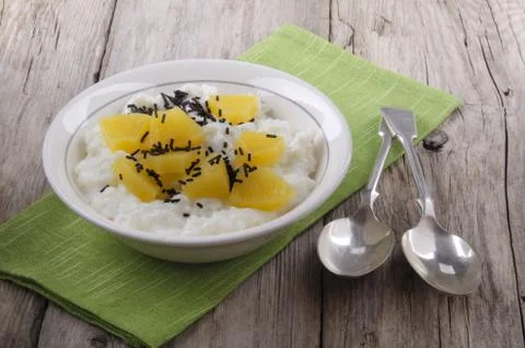Rice pudding with pineapple in a bowl Stock Photos