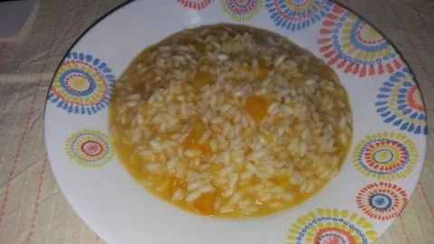 Rice with pumpkin. Risotto con la zucca, Italian food Stock Footage 151823800