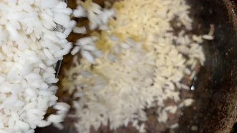 Rice is put into the pan Stock Footage 221271796