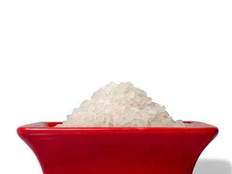 Rice in a red rectangular saucer isolated on white background. Close-up Stock Photos