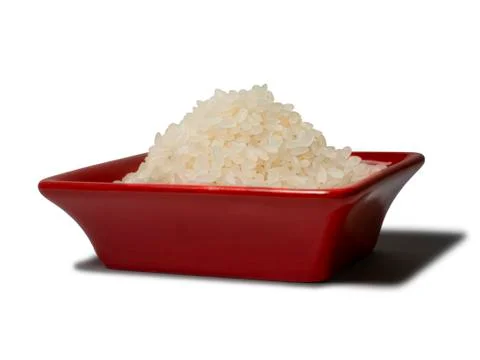 Rice in a red rectangular saucer isolated on white background. Close-up Stock Photos