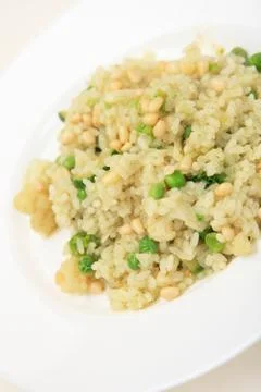 Rice of Risotto with vegetables and beans on white plate Stock Photos