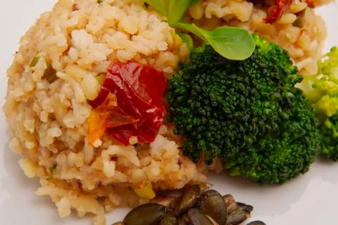 Rice risotto with vegetables on a table Stock Photos