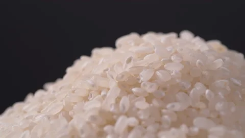Rice rotate on black background, Close up of Japanese rice Stock Footage 139430565