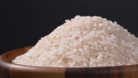 Rice rotate on black background, Close up of Japanese rice Stock Footage 140251573