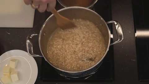 Rice simmering in wine overhead Stock Footage 112127598