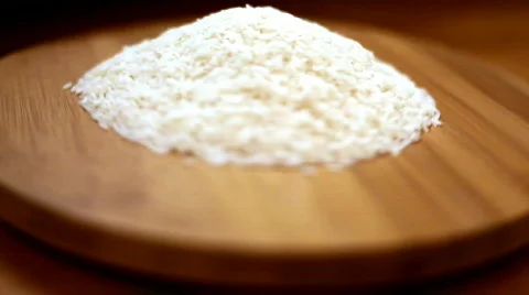 Rice spinning on a counter platform. Stock Footage 311619