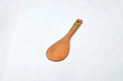 Rice spoon made from medium brown wood Stock Photos