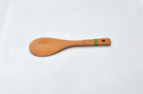 Rice spoon made from medium brown wood Stock Photos
