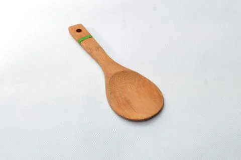 Rice spoon made from medium brown wood Stock Photos