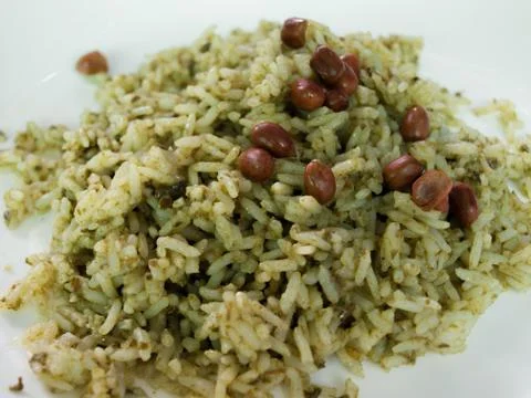 RICE STIR WITH LAHPET (PICKLED TEA LEAVES) TOPPING WITH FRIED PEANUTS Stock Photos