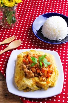Rice ,stuffed omelette and tom kha kai ,chicken with coconut milk soup. Stock Photos