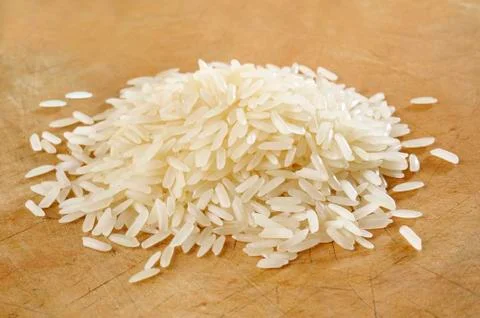 Rice on wood background Stock Photos