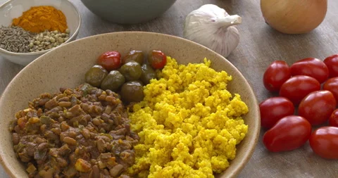 Ricebean dal served with pickled chilies and millet groats. Stock Footage 277917700