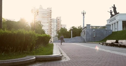 A rich businessman with a briefcase throws white sheets of paper in the city. Stock Footage 117685498