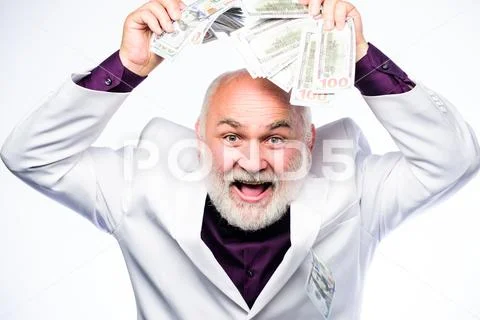 Rich grandpa. Successful lucky businessman. Senior man pensioner hold cash money Stock-Fotos
