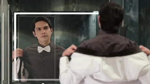 Rich handsome millennial men in a luxury hotel looking himself in the mirror Stock Footage 197408564