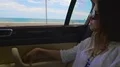 Rich lady in sunglasses riding in car and enjoying cool view on ocean, vacation HD Footage