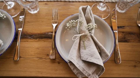 A rich luxury wedding with elements of dish decoration, golden plates, knives, Stock Footage 115789352