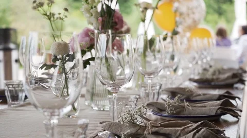A rich luxury wedding with elements of dish decoration, golden plates, knives, Video stock 115789394