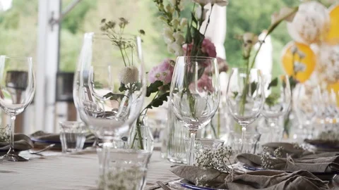 A rich luxury wedding with elements of dish decoration, golden plates, knives, Stock Footage 115789638
