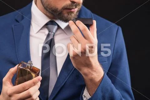Rich man prefers expensive cologne Stock Photos