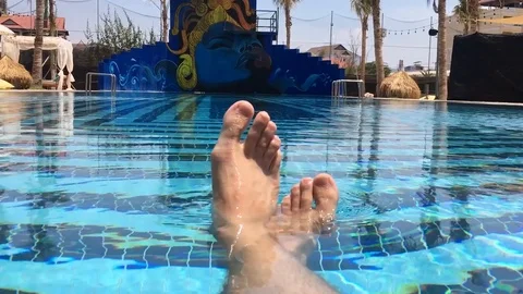 Rich man relaxes in the pool Stock Footage 121357159