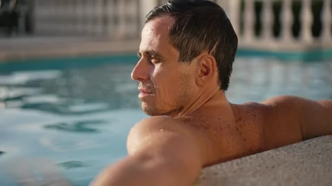 Rich man relaxing in the pool Stock Footage 290775123