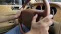 Rich man slowly riding along street on retro car, luxury vintage collection HD Footage