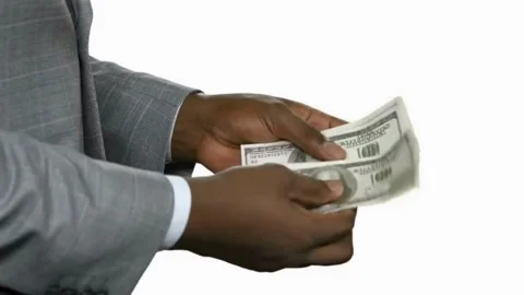 Rich man in suit on white background holding bundle of dollar money in his Stock-Footage 336264100