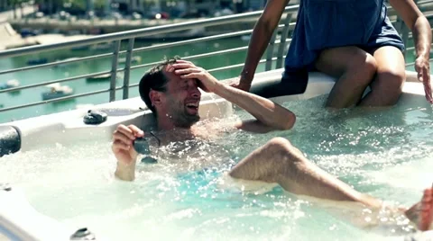 Rich people having fun in jacuzzi, slow motion shot at 240fps Stock Footage