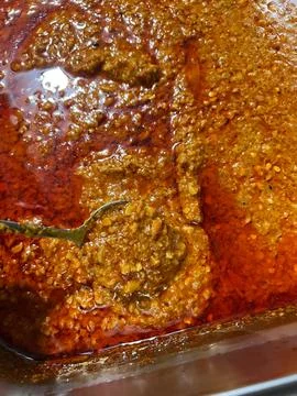Rich Red Mixture with Texture and Shine in Cooking Pot with Spoon, Perfect .. 스톡 사진