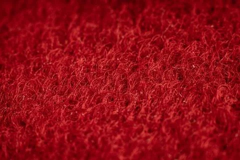 Rich textured fabric in deep red showcasing a unique weave pattern suitable for Stock Photos