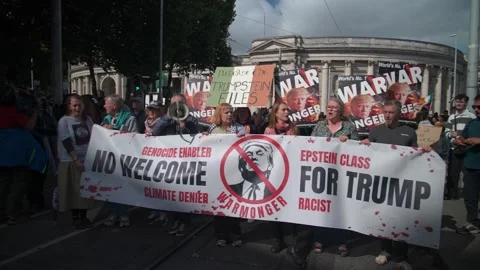 Richard Boyd Barrett protests Donald Trump in front of Trinity College Dublin Stock Footage 346257048