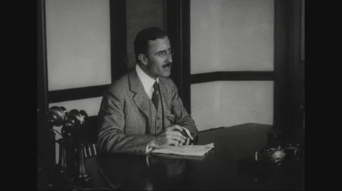 Richard G. Cholmeley-Jones working in office Stock Footage