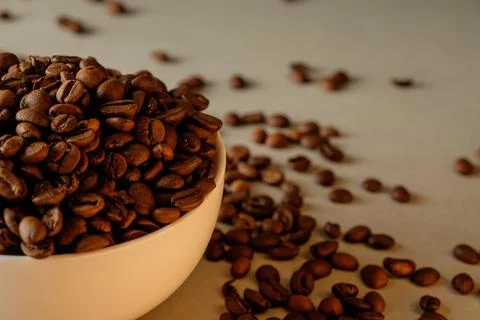 Richly roasted coffee beans create an inviting aroma in a cozy setting Stock Photos