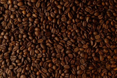 Richly roasted coffee beans create a tapestry of deep, aromatic colors Stock Photos