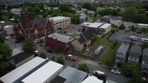 Richmond skyline with pan down to view fire rescue scene Stock Footage 240212527