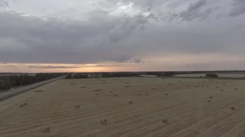 Rick of straw at sunset from a height Stock Footage 68027424